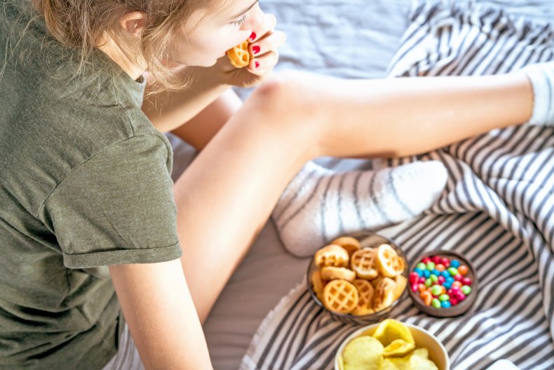 Girl snacking in bed