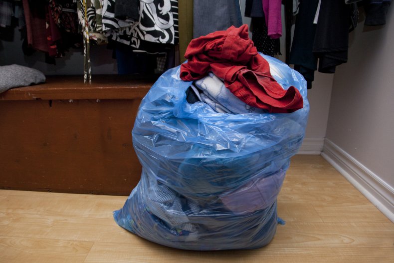 Trash bag full of clothes