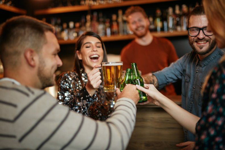Friends gather for drinks at a bar
