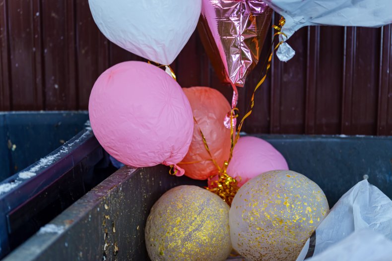 File photo of balloons in the trash.