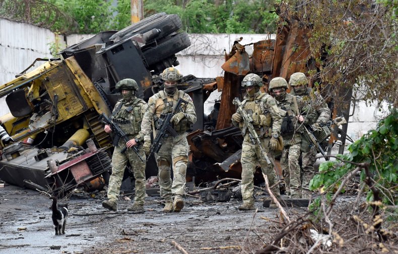 Russian servicemen patrol Mariupol