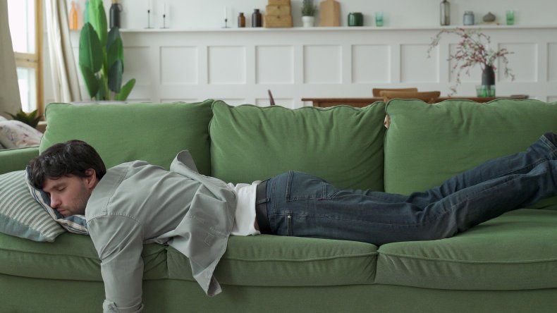 Man asleep on sofa