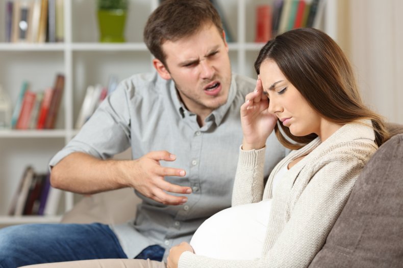 man arguing with pregnant woman