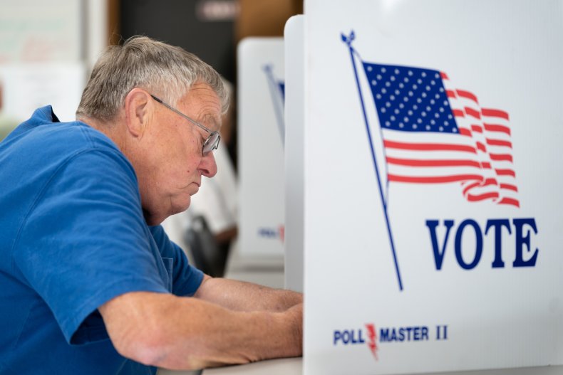 A man fills out a ballot 