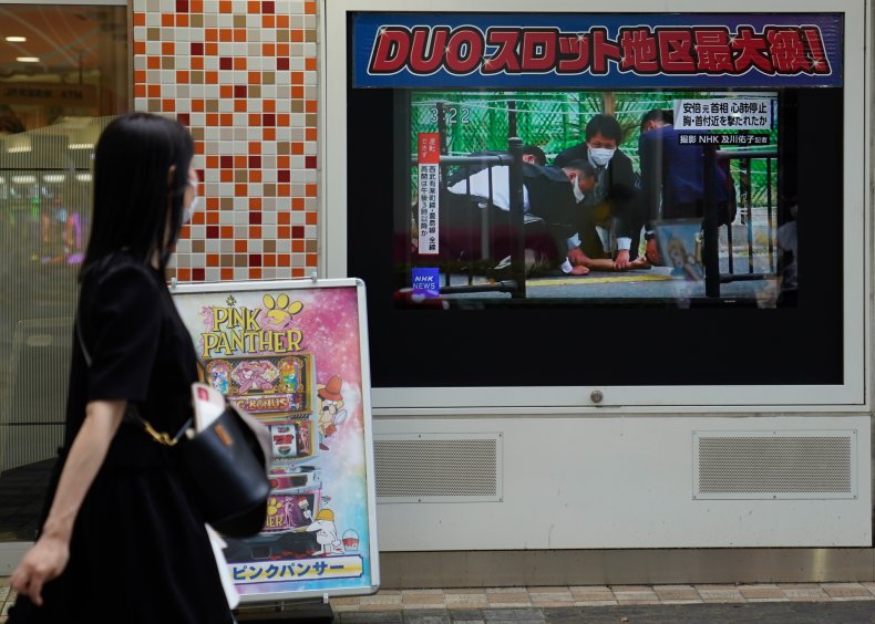 A woman looks at a screen 