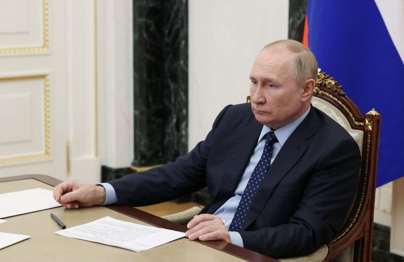 Vladimir Putin attends a meeting 