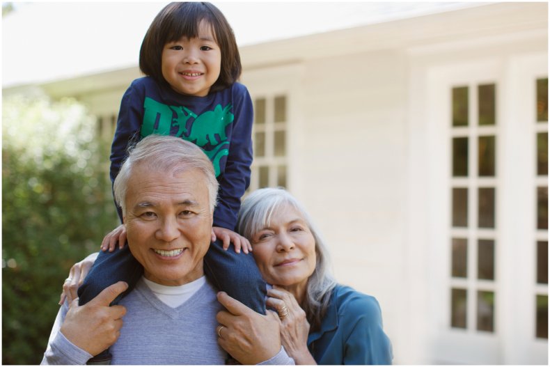 Stock image of grandparents and child