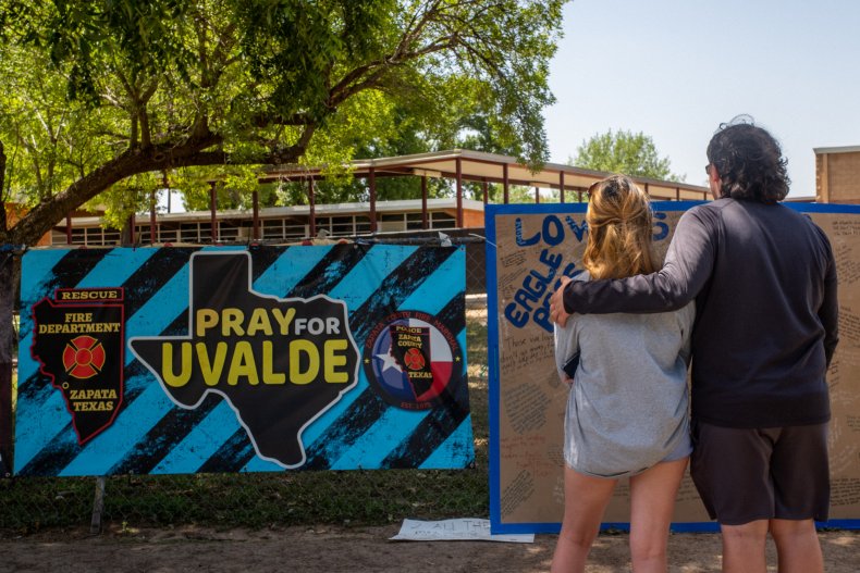 People Pay Respects to an Uvalde Memorial