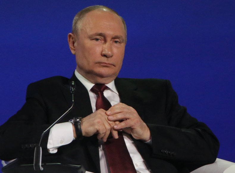 Vladimir Putin addresses a plenary session