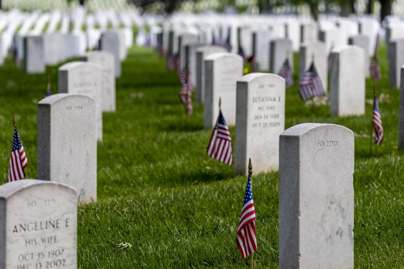 Headstones with American flags are seen