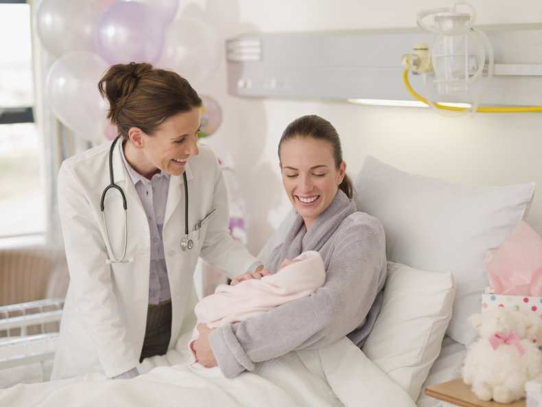 mother holding newborn