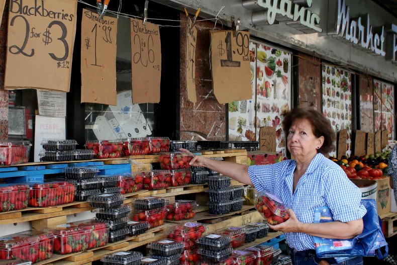 Woman buying strawberries