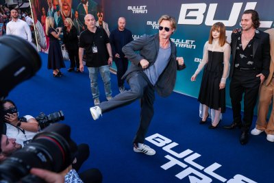 Brad Pitt Playfully Kicks Photographers Bullet Train
