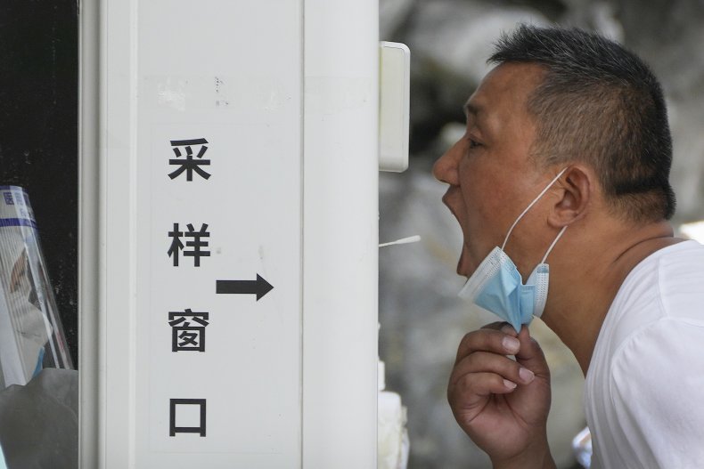 China COVID testing man swab