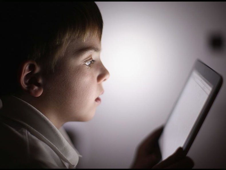 Boy child kid using Apple iPad