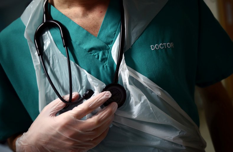 Doctor holds stethoscope at hospital