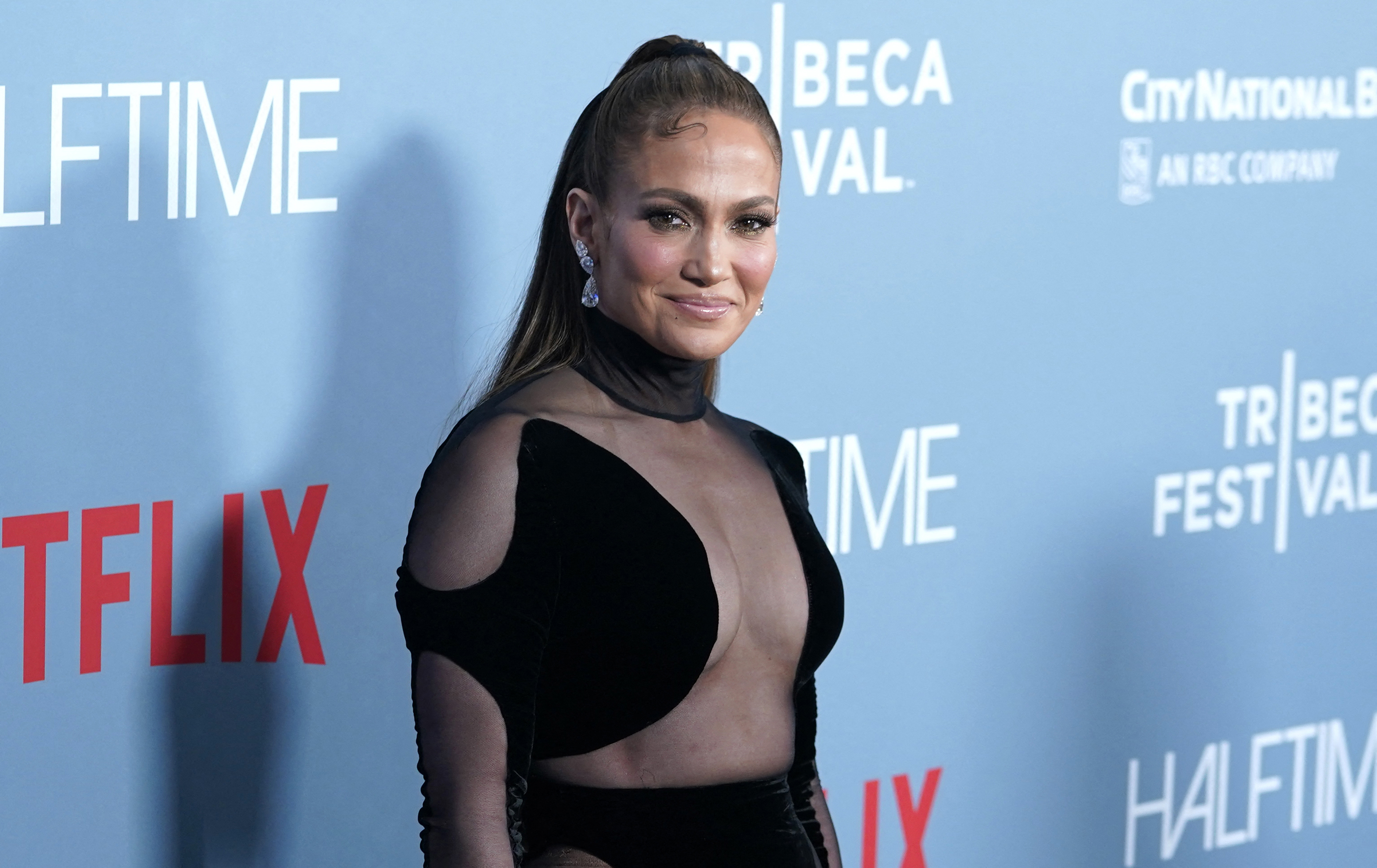 Jennifer Lopez flaunts her famous curves in cropped black sweater