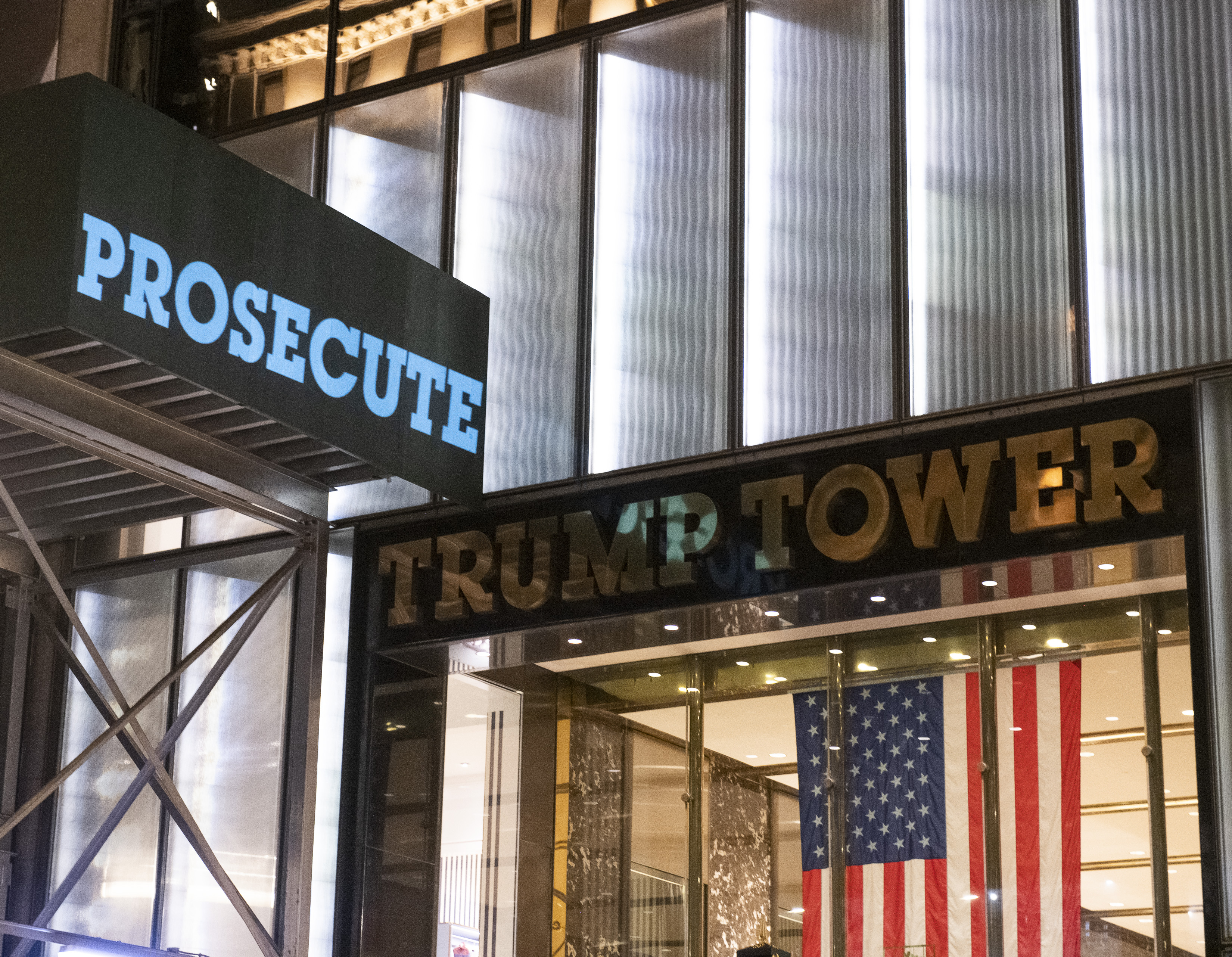 'Prosecute Trump' Sign Appears Outside Trump Tower After Jan. 6 Hearing