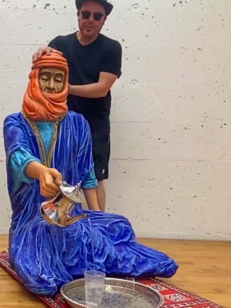 Felix Semper with man origami sculpture