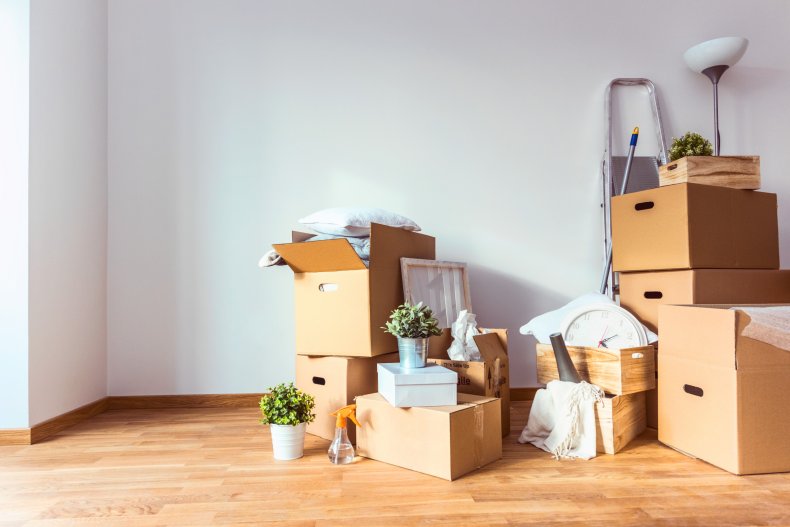 Moving boxes in empty apartment