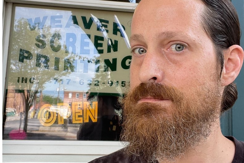 Aaron Weaver In Front of His Store