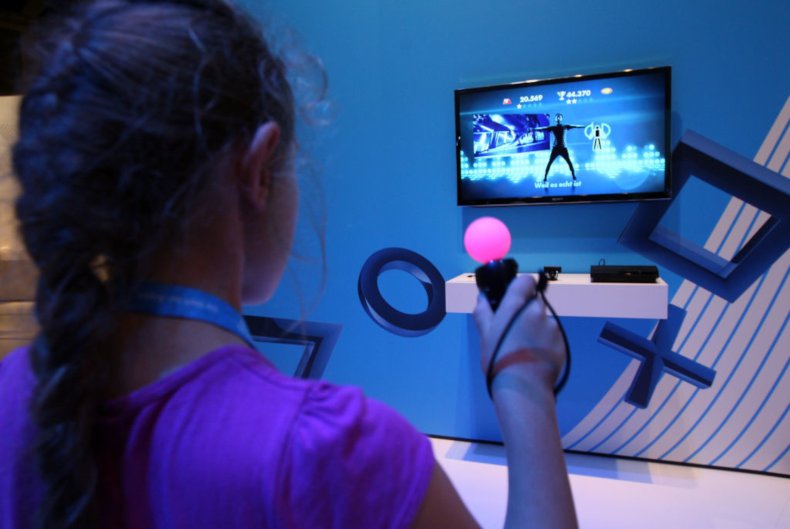 A girl plays a dancing game on a Playstation 3 (PS3) video console on August 31, 2012 in Berlin, Germany.  (Photo by Adam Berry/Getty Images)