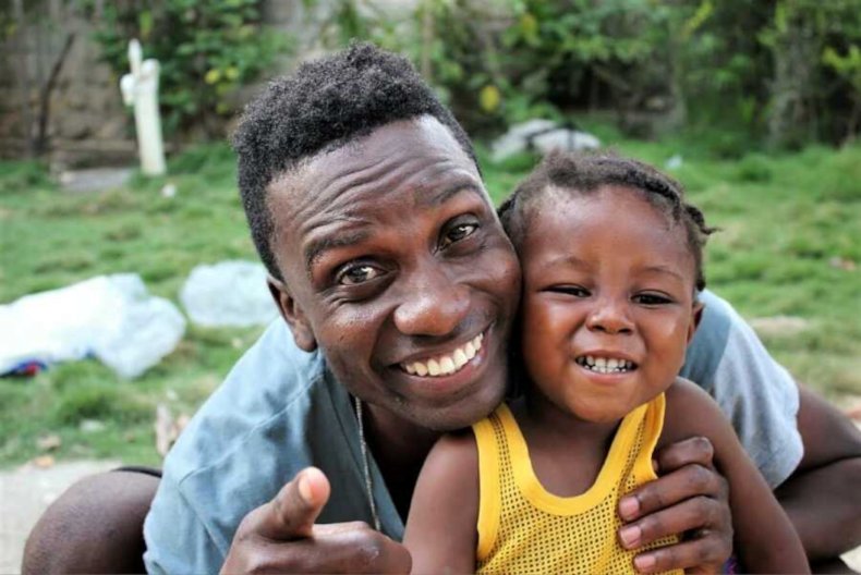 pJimmy Amisial and baby Emilio Angel Jeremiah pose for a picture (undated) in their home in the city of Gonaives, Haiti. Amisial saved baby Emilio in December, 2017 from a trashcan and is currently in the process of adopting him. (JimmyAmisial, SWNS/Zenge