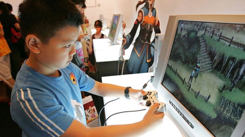 Boy plays video game in China