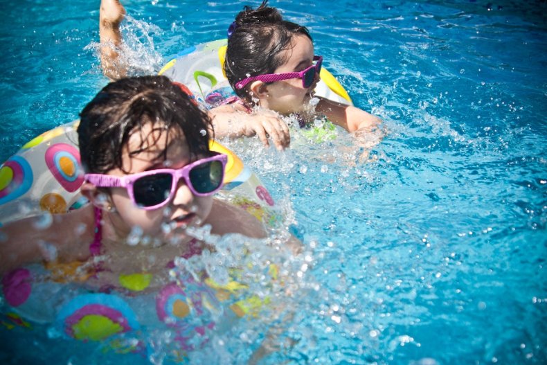 Kids swim in pool