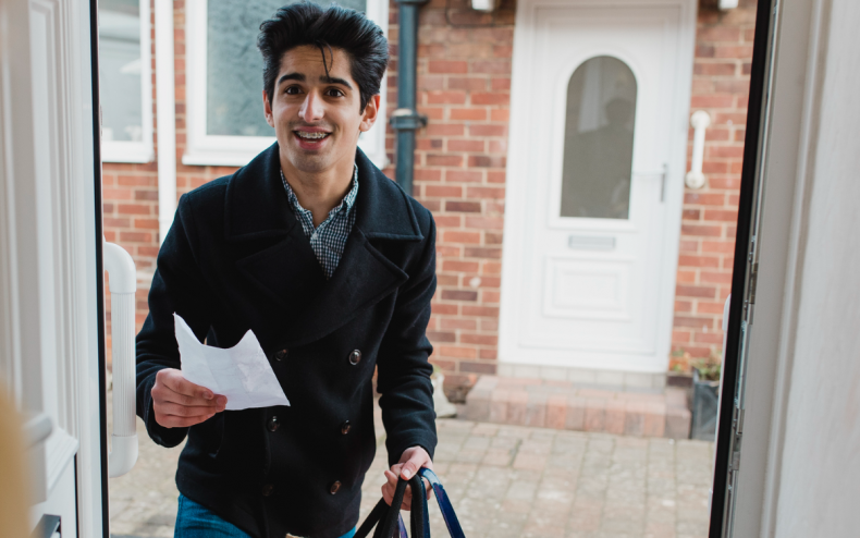A teenager arriving at a front door.