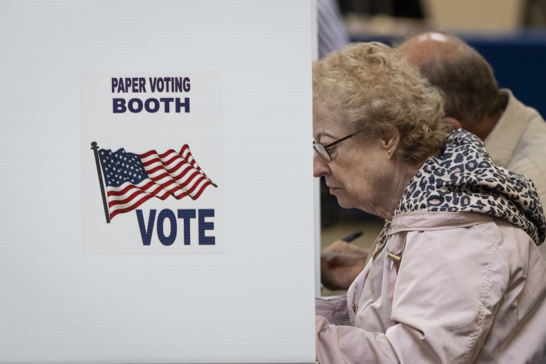 Voters use an optional paper ballot booth