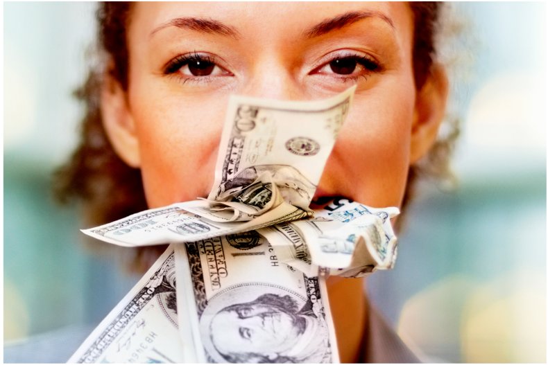 File photo of woman and money.