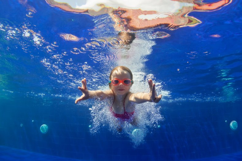 Young girl swimming underwater
