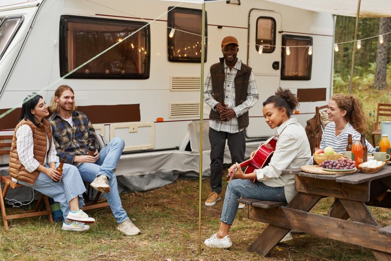 people hanging out by campervan