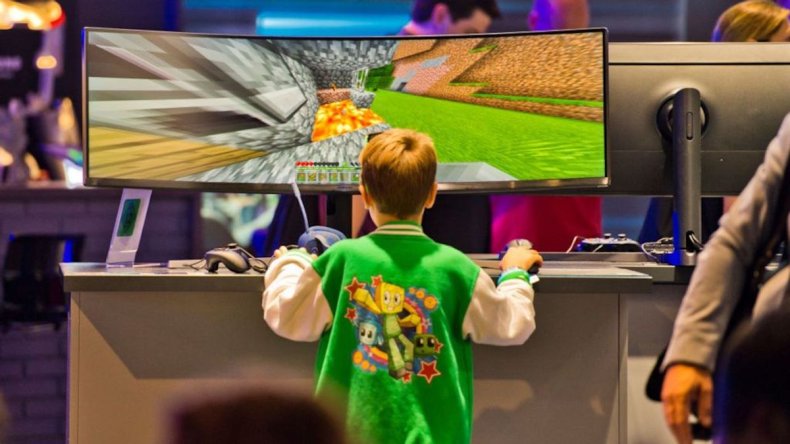 Boy Playing Video Game On Ultrawide Tv
