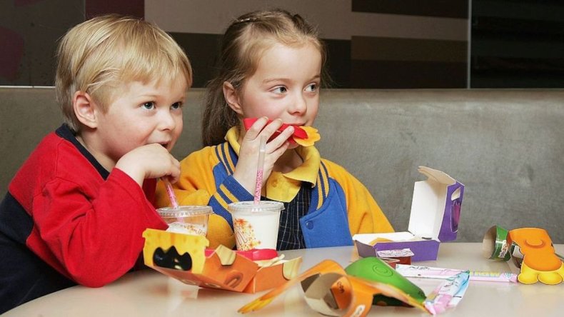 Kids eat Happy Meals at McDonald's