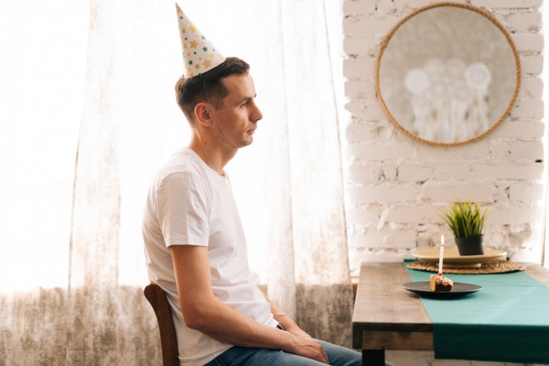 Sad man at birthday party