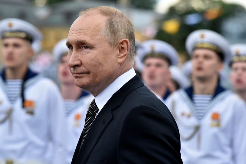 Vladimir Putin attends a parade 