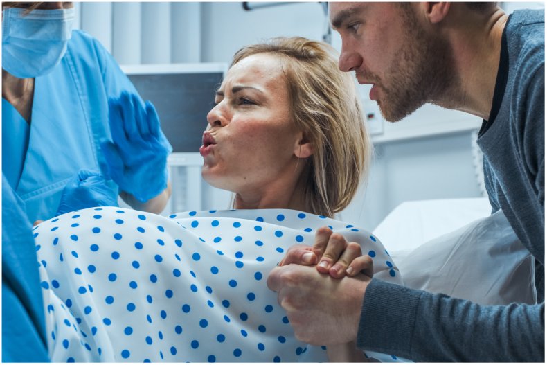 Stock image of a woman giving birth