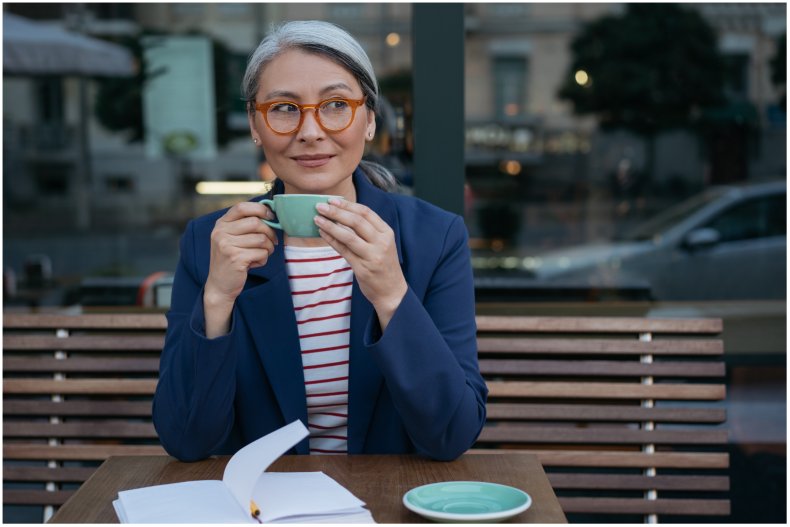 Stock image of a woman sitting down