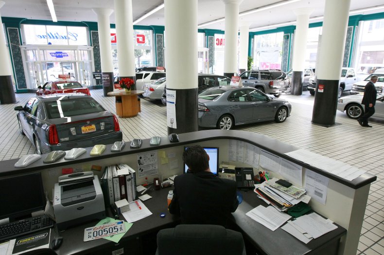 Man Working at Car Dealership