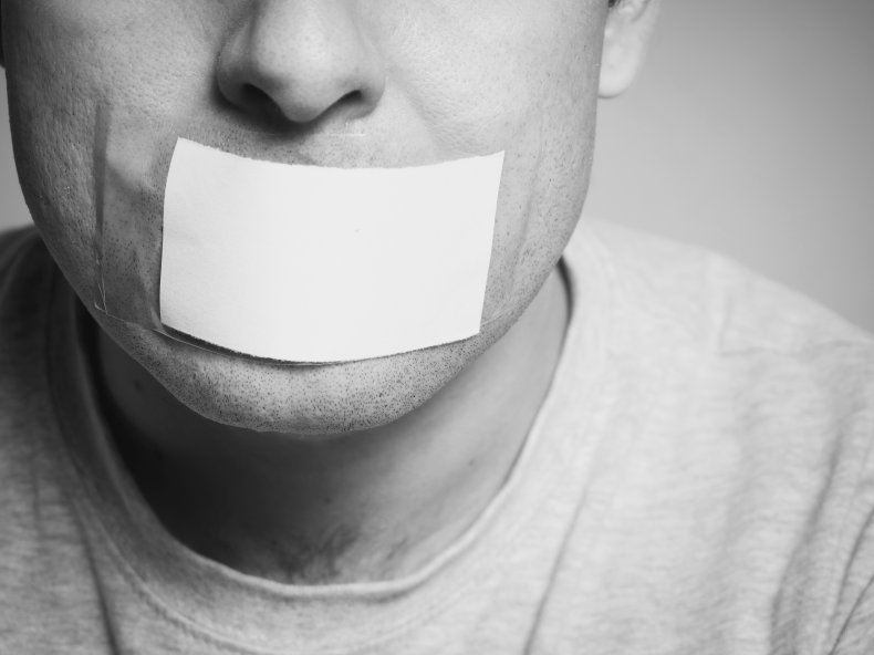 Man with tape across mouth