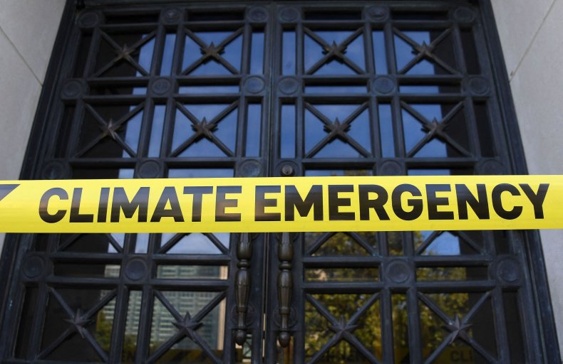 "Climate Emergency" yellow tape 