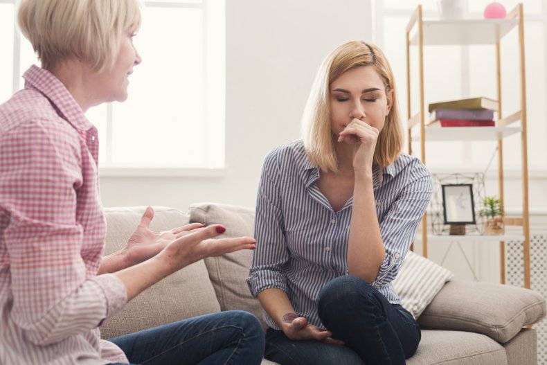 Women argue on couch