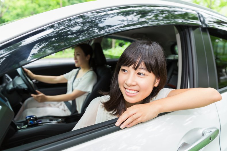 Woman picking up sister from aunts