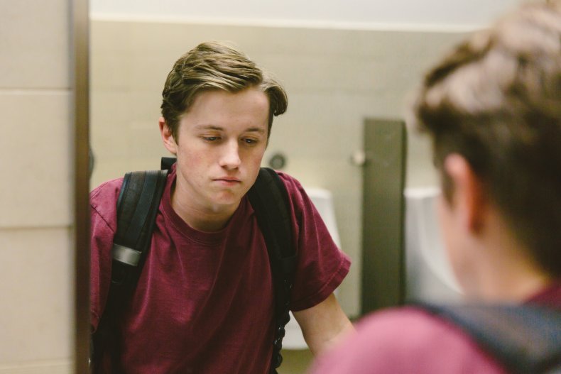 Teenager in bathroom