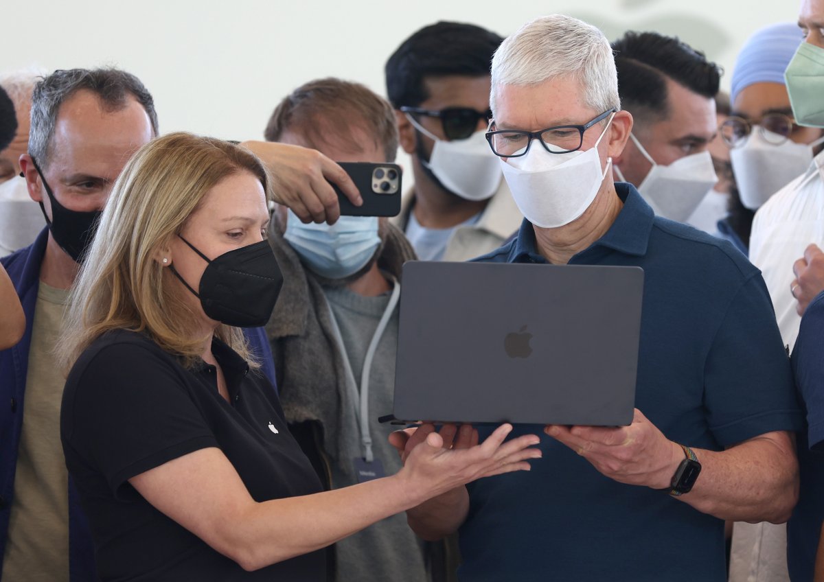 Apple CEO Tim Cook seen with MacBook