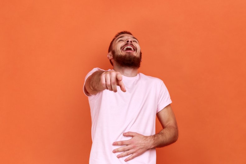 Man laughing at the camera