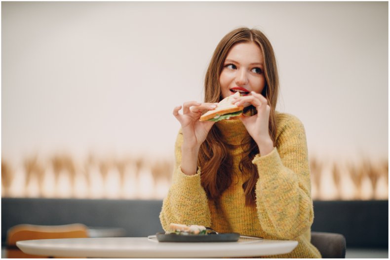 Stock image of a teenag girl eating
