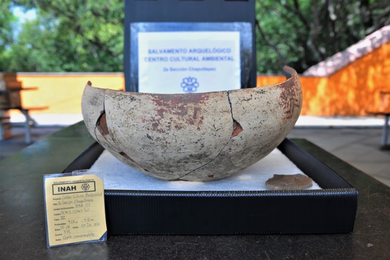Photo shows white bowl with red geometric pattern, which was broken on purpose, undated photo. An archaeological discovery in Bosque de Chapultepec, Mexico revealed it as one of the oldest sites in the Basin of Mexico.  (Mauricio Marat, INAH/Zenger)